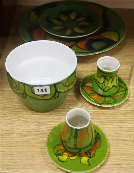 A Poole pottery green ground large dish, no 5, three smaller dishes, a bowl and two small vases